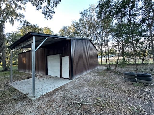 374 Sisco Road Pomona Park, FL 32181 - Photo 14 of 51 a view of a small house with a yard