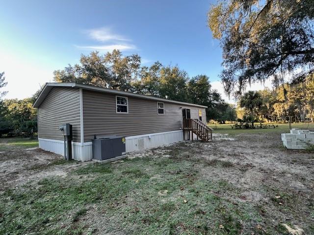 374 Sisco Road Pomona Park, FL 32181 - Photo 23 of 51 a view of a house with a yard