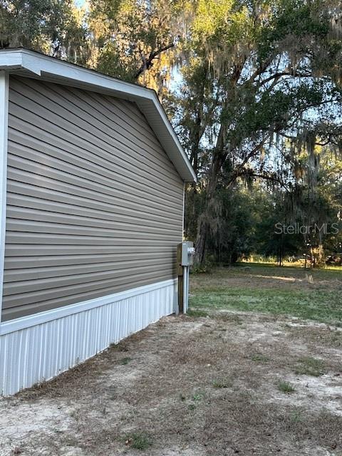 374 Sisco Road Pomona Park, FL 32181 - Photo 24 of 51 a view of backyard with large trees and wooden fence