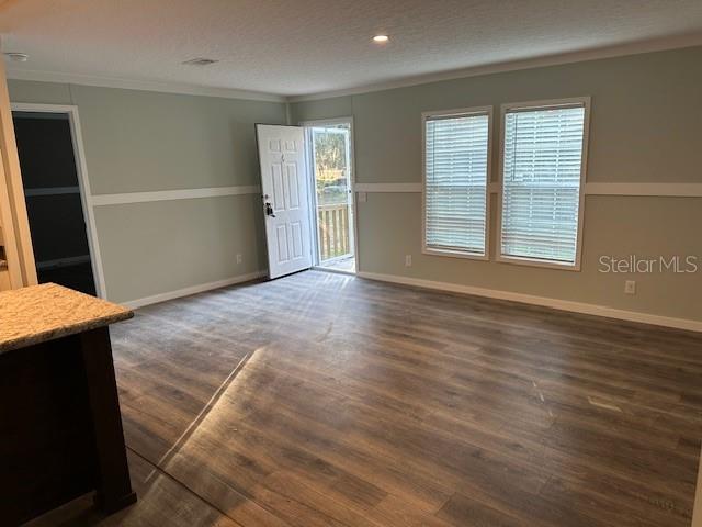 374 Sisco Road Pomona Park, FL 32181 - Photo 30 of 51 an empty room with wooden floor and windows