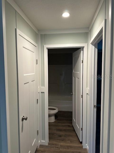 374 Sisco Road Pomona Park, FL 32181 - Photo 31 of 51 a view of a hallway with wooden floor and closet area
