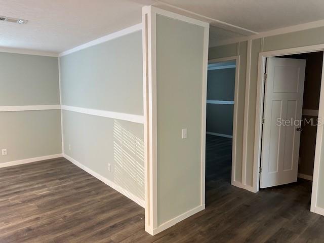 374 Sisco Road Pomona Park, FL 32181 - Photo 32 of 51 a view of an empty room with wooden floor & closet