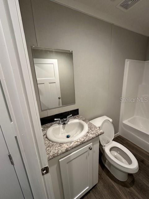 374 Sisco Road Pomona Park, FL 32181 - Photo 35 of 51 a bathroom with a granite countertop toilet sink and mirror