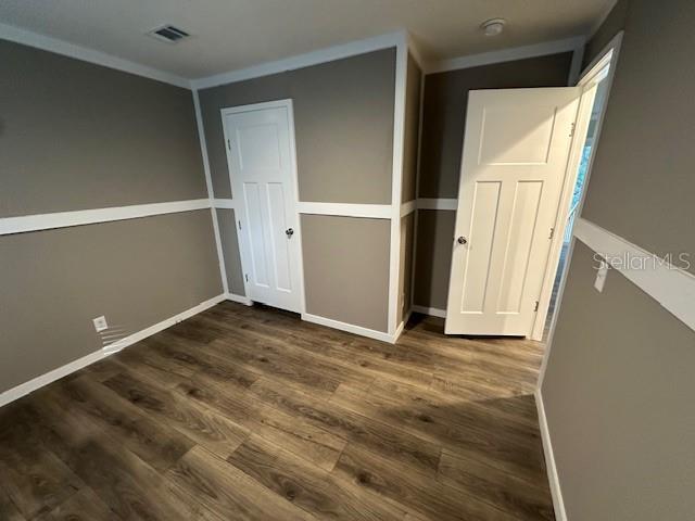 374 Sisco Road Pomona Park, FL 32181 - Photo 37 of 51 a view of an empty room with wooden floor and closet