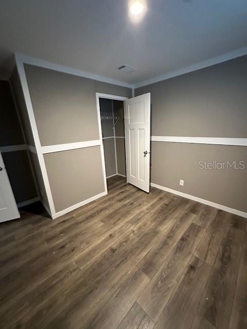 374 Sisco Road Pomona Park, FL 32181 - Photo 40 of 51 an empty room with wooden floor and entrance