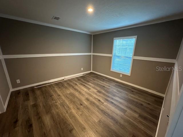 374 Sisco Road Pomona Park, FL 32181 - Photo 42 of 51 a view of an empty room with wooden floor and a window