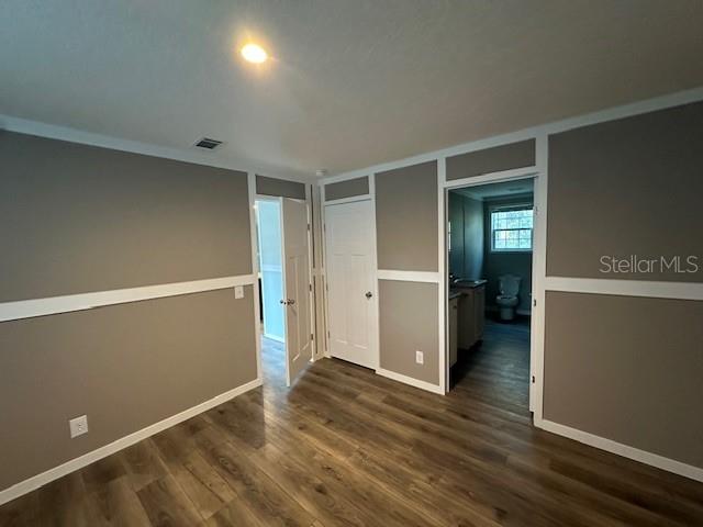 374 Sisco Road Pomona Park, FL 32181 - Photo 43 of 51 an empty room with wooden floor and closet