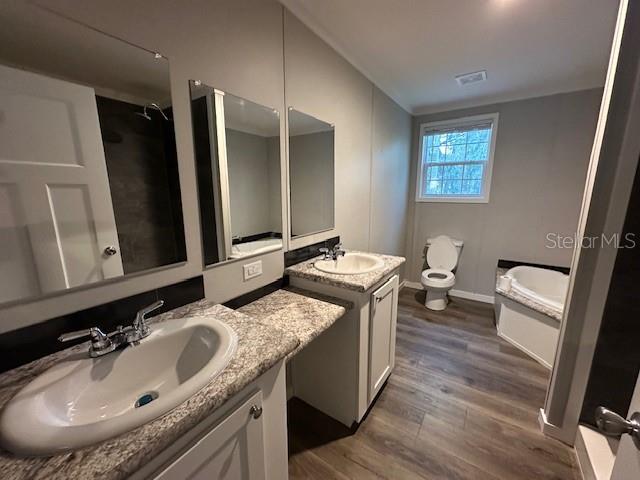 374 Sisco Road Pomona Park, FL 32181 - Photo 45 of 51 a bathroom with a granite countertop sink a mirror and a toilet