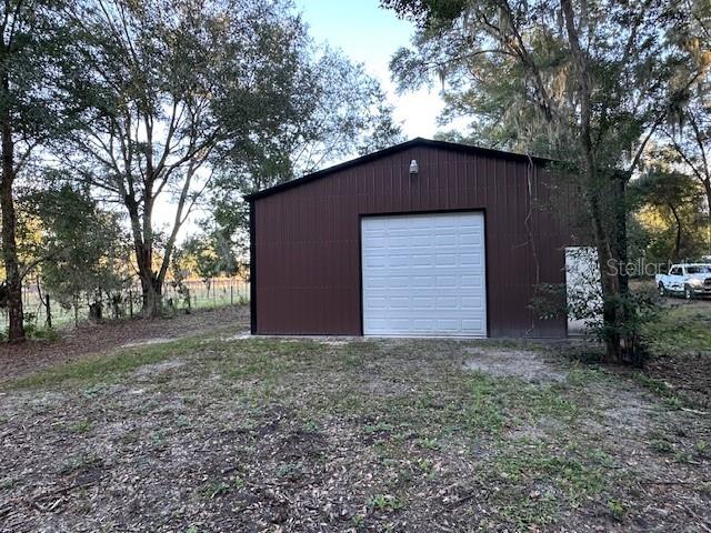 374 Sisco Road Pomona Park, FL 32181 - Photo 7 of 51 a house with trees in front of it
