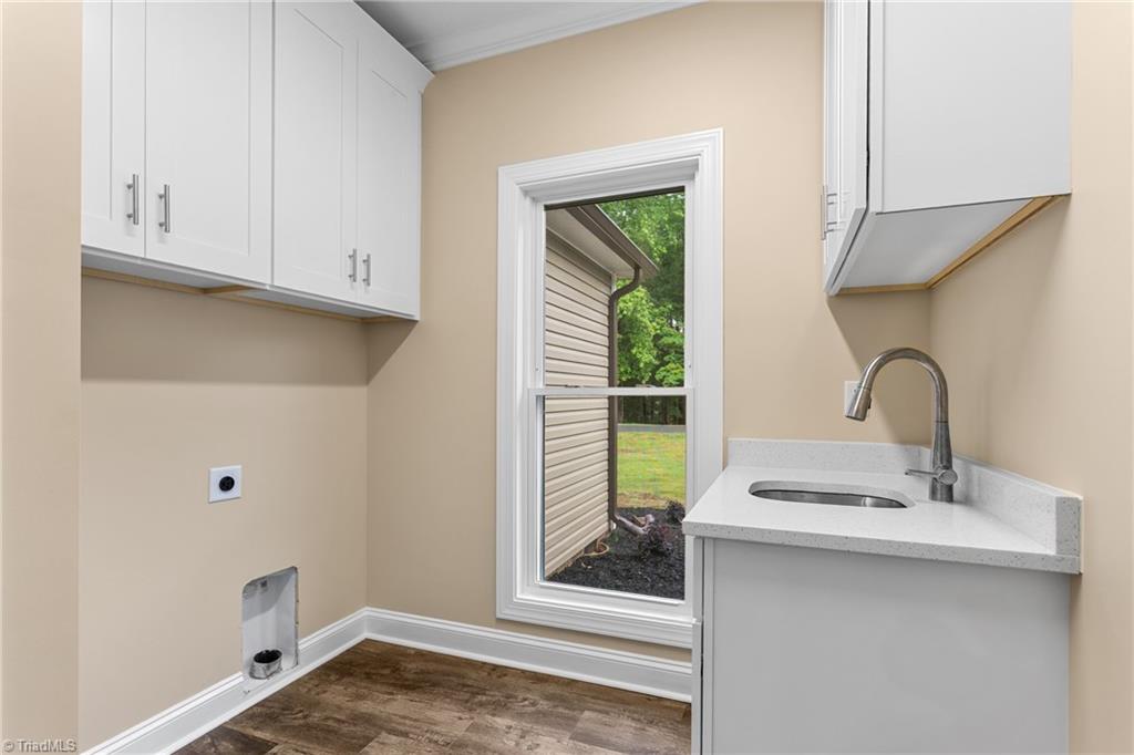311 Marigold Lane Lexington, NC 27292 - Photo 26 of 48 laundry room complete with utility sink and cabinet space