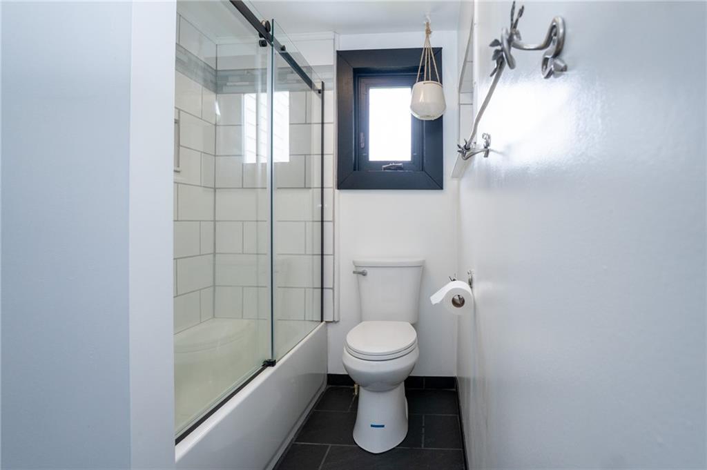 10 North Street Atlasburg, PA 15004 - Photo 14 of 27 a bathroom with a toilet and a shower