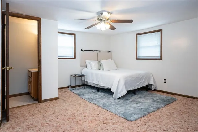a white toilet sitting next to a shower