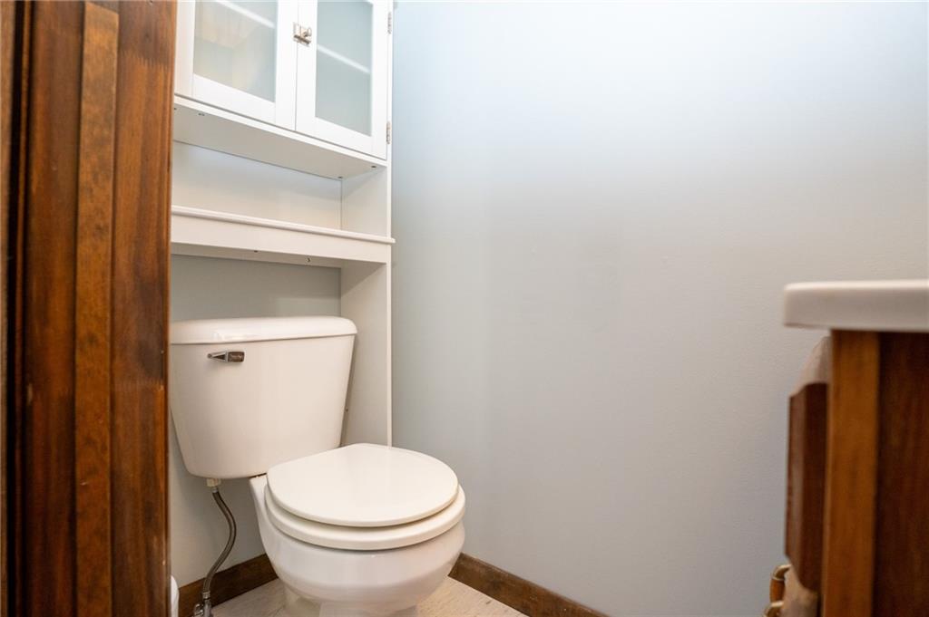 10 North Street Atlasburg, PA 15004 - Photo 19 of 27 a white toilet sitting next to a shower