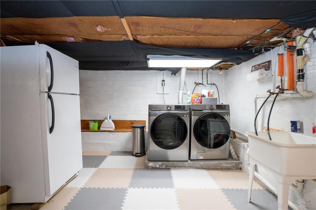 10 North Street Atlasburg, PA 15004 - Photo 20 of 27 a utility room with sink dryer and washer
