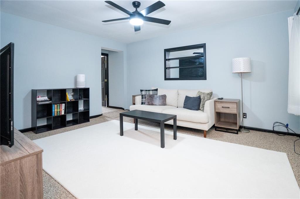 10 North Street Atlasburg, PA 15004 - Photo 2 of 27 a living room with furniture and a flat screen tv