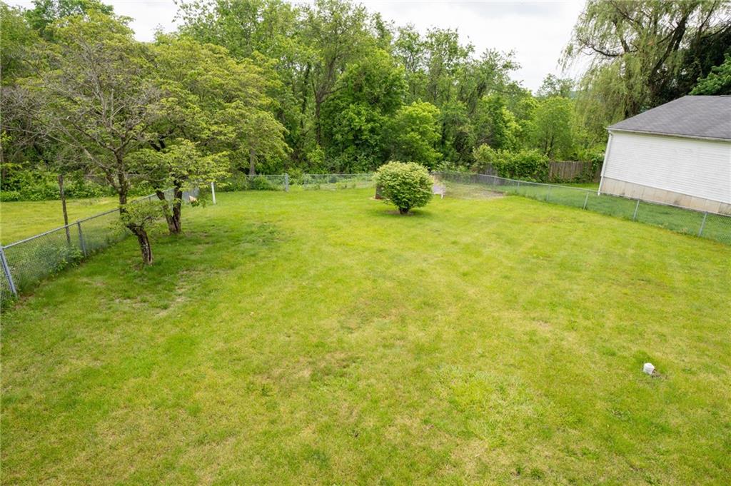 10 North Street Atlasburg, PA 15004 - Photo 24 of 27 a swimming pool with some trees in the background