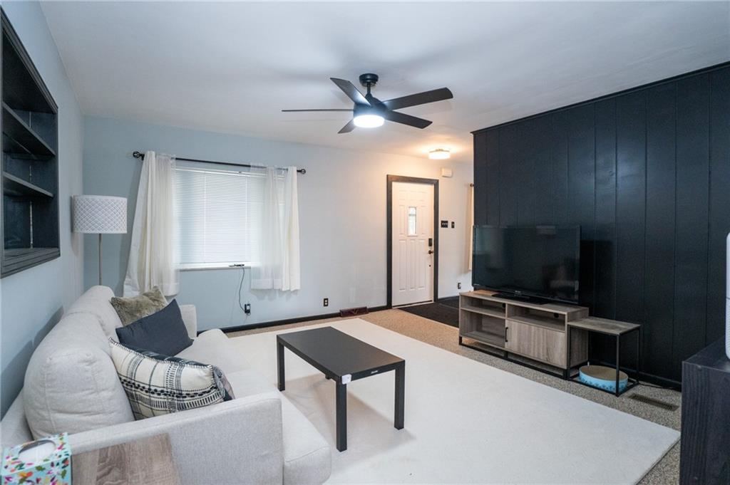10 North Street Atlasburg, PA 15004 - Photo 3 of 27 a living room with furniture and a flat screen tv