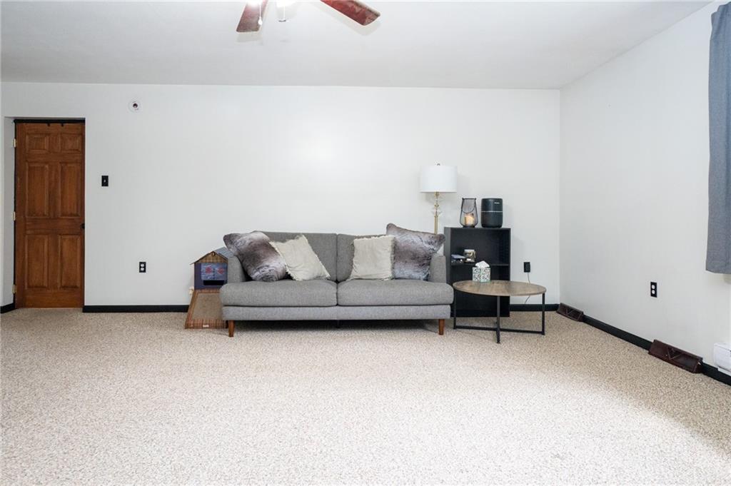 10 North Street Atlasburg, PA 15004 - Photo 9 of 27 a living room with furniture and a lamp