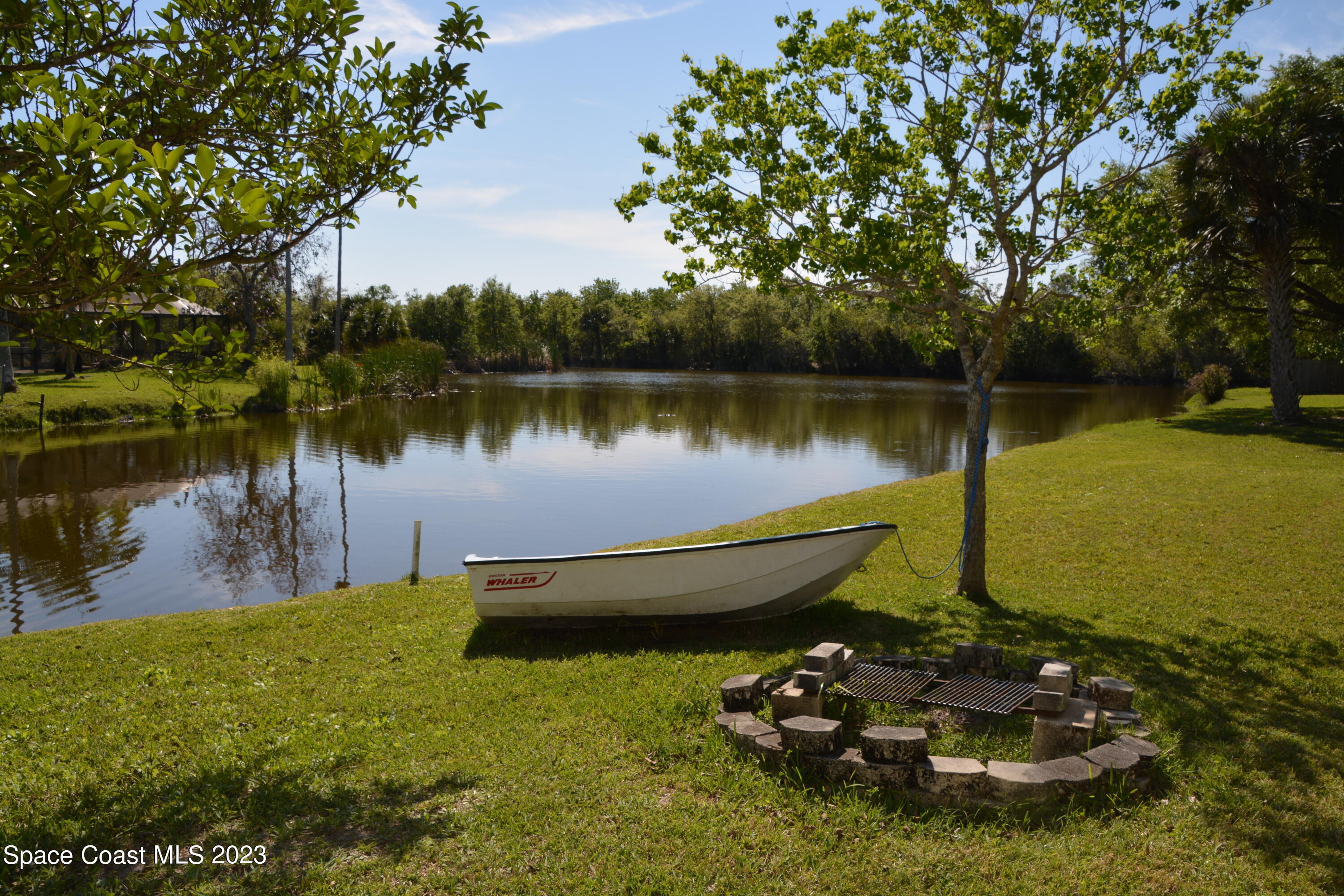 1045 Pine Island Road Merritt Island, FL 32953 - Photo 30 of 42 a view of a lake with a lake