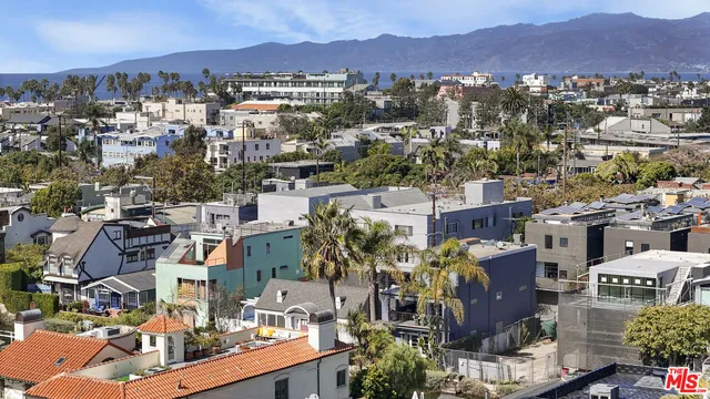 an aerial view of residential houses and outdoor space