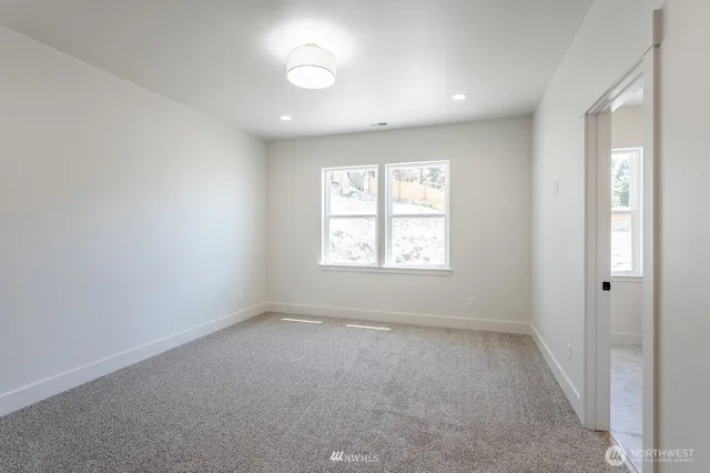 a bathroom with a double vanity sink mirror and