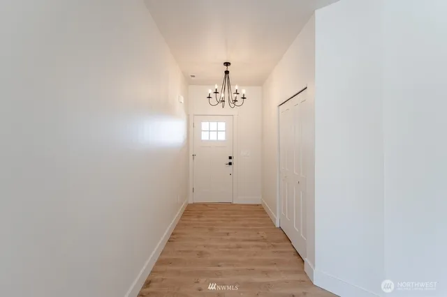 a kitchen with a sink a window and cabinets