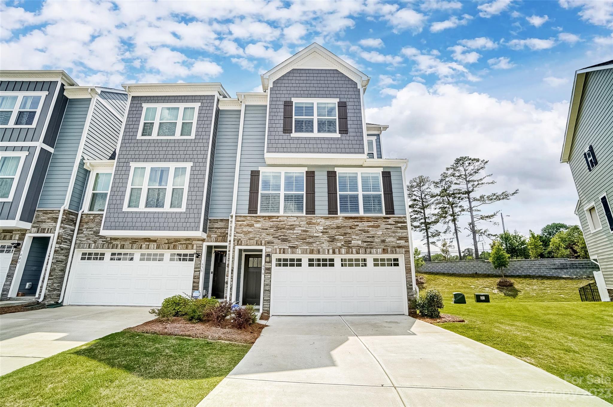 636 Crudent Road Tega Cay, SC 29708 - Photo 1 of 45 a front view of a house with garden
