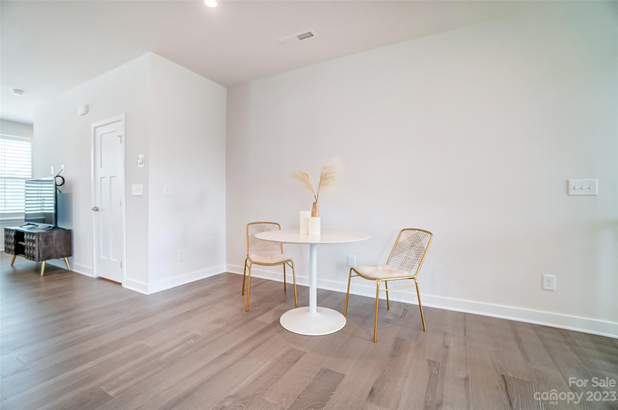 636 Crudent Road Tega Cay, SC 29708 - Photo 15 of 45 a living room with furniture and a wooden floor