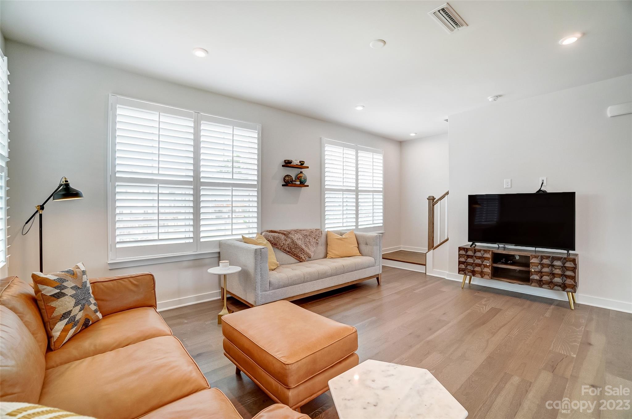 636 Crudent Road Tega Cay, SC 29708 - Photo 20 of 45 a living room with furniture and a flat screen tv