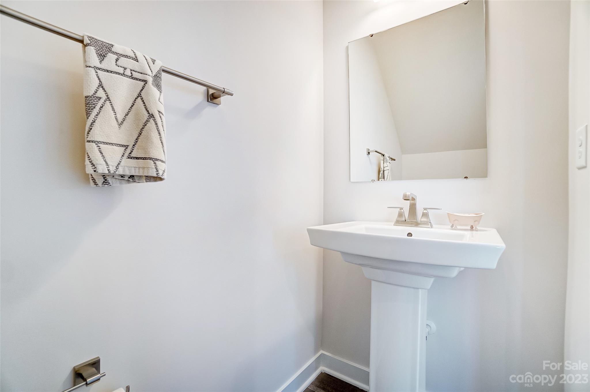 636 Crudent Road Tega Cay, SC 29708 - Photo 21 of 45 a bathroom with a sink a light fixture and a mirror