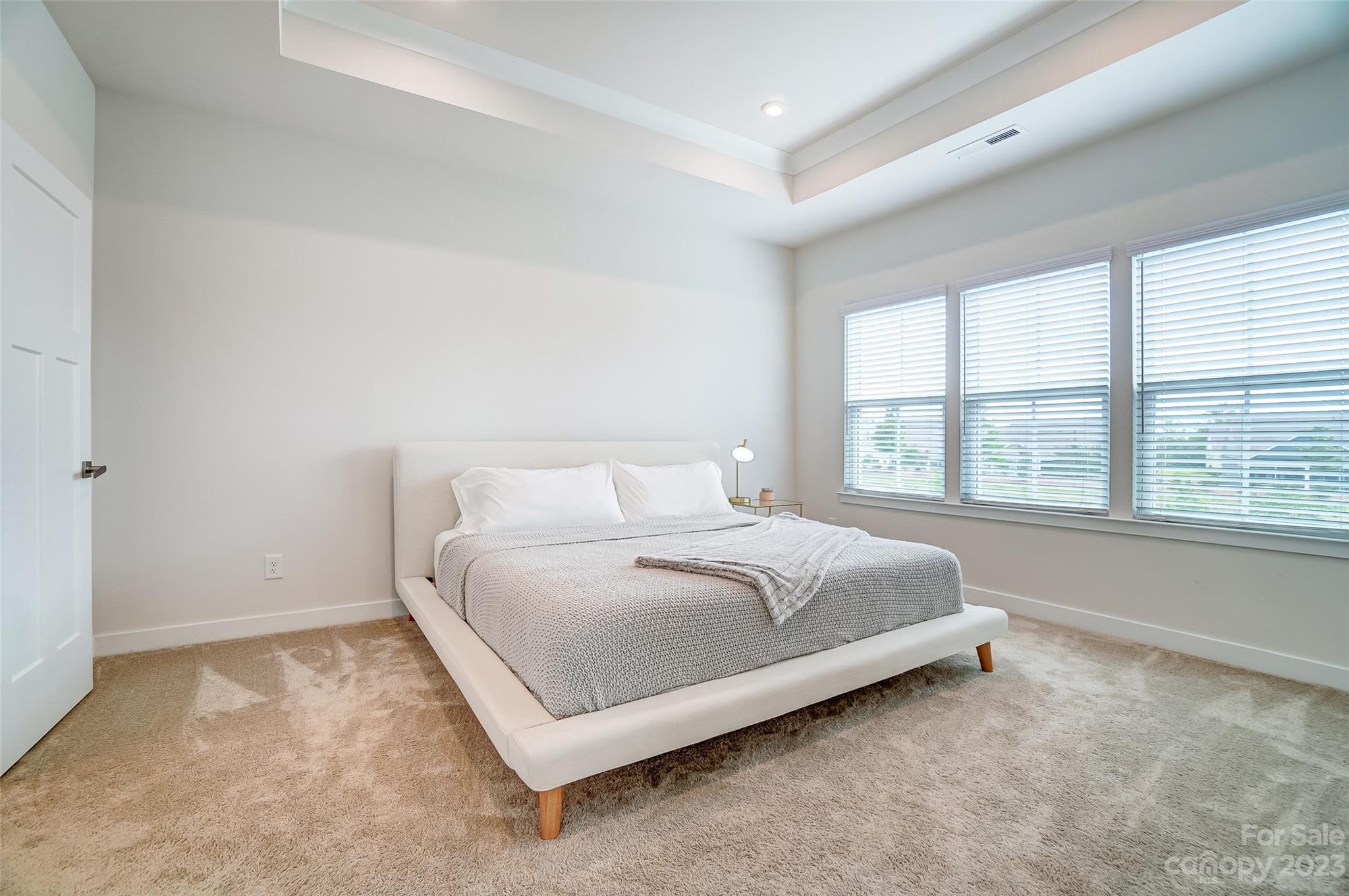 636 Crudent Road Tega Cay, SC 29708 - Photo 26 of 45 a bed sitting in a bedroom next to a window