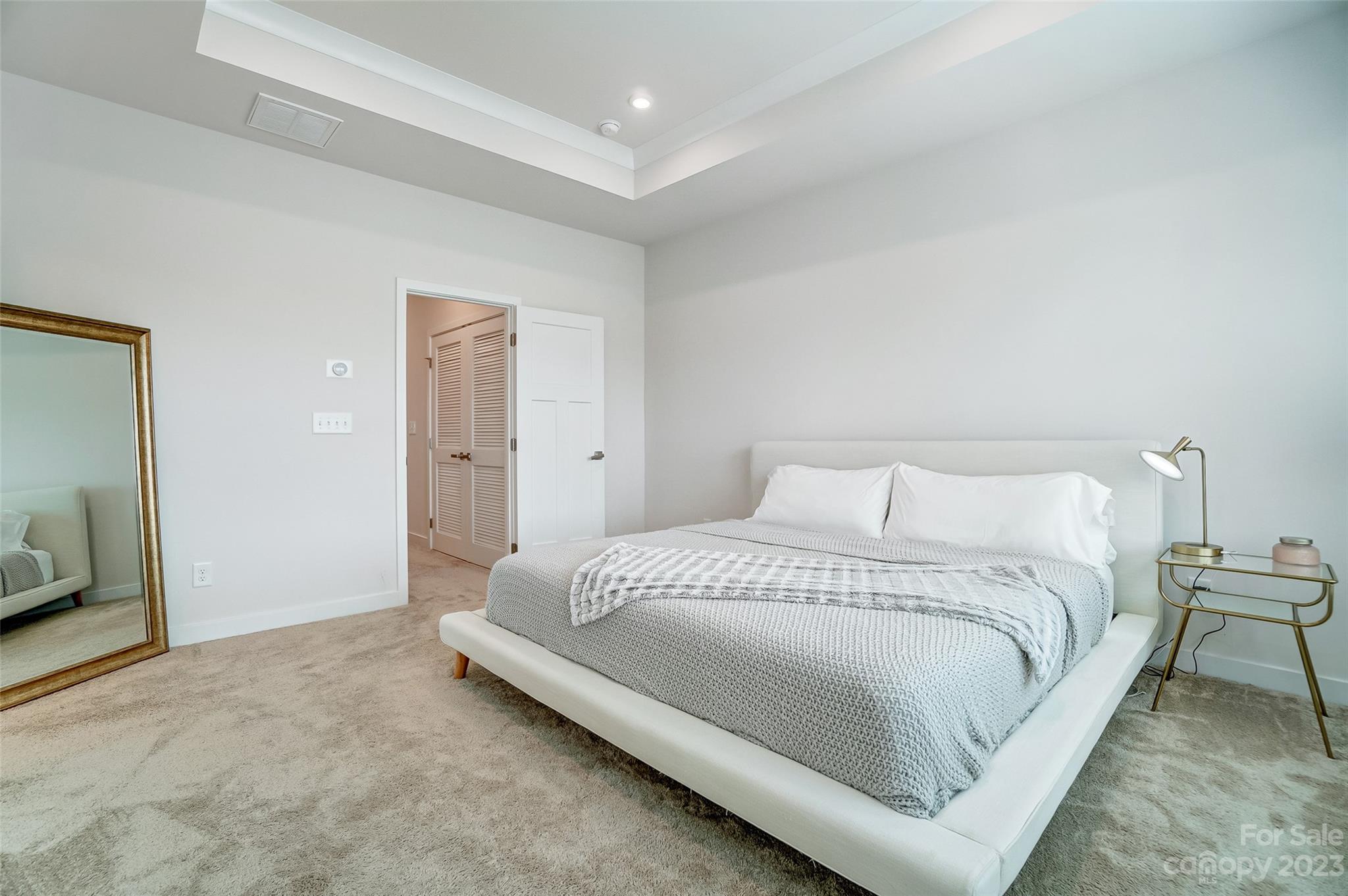 636 Crudent Road Tega Cay, SC 29708 - Photo 28 of 45 a large bedroom with a bed and wooden floor