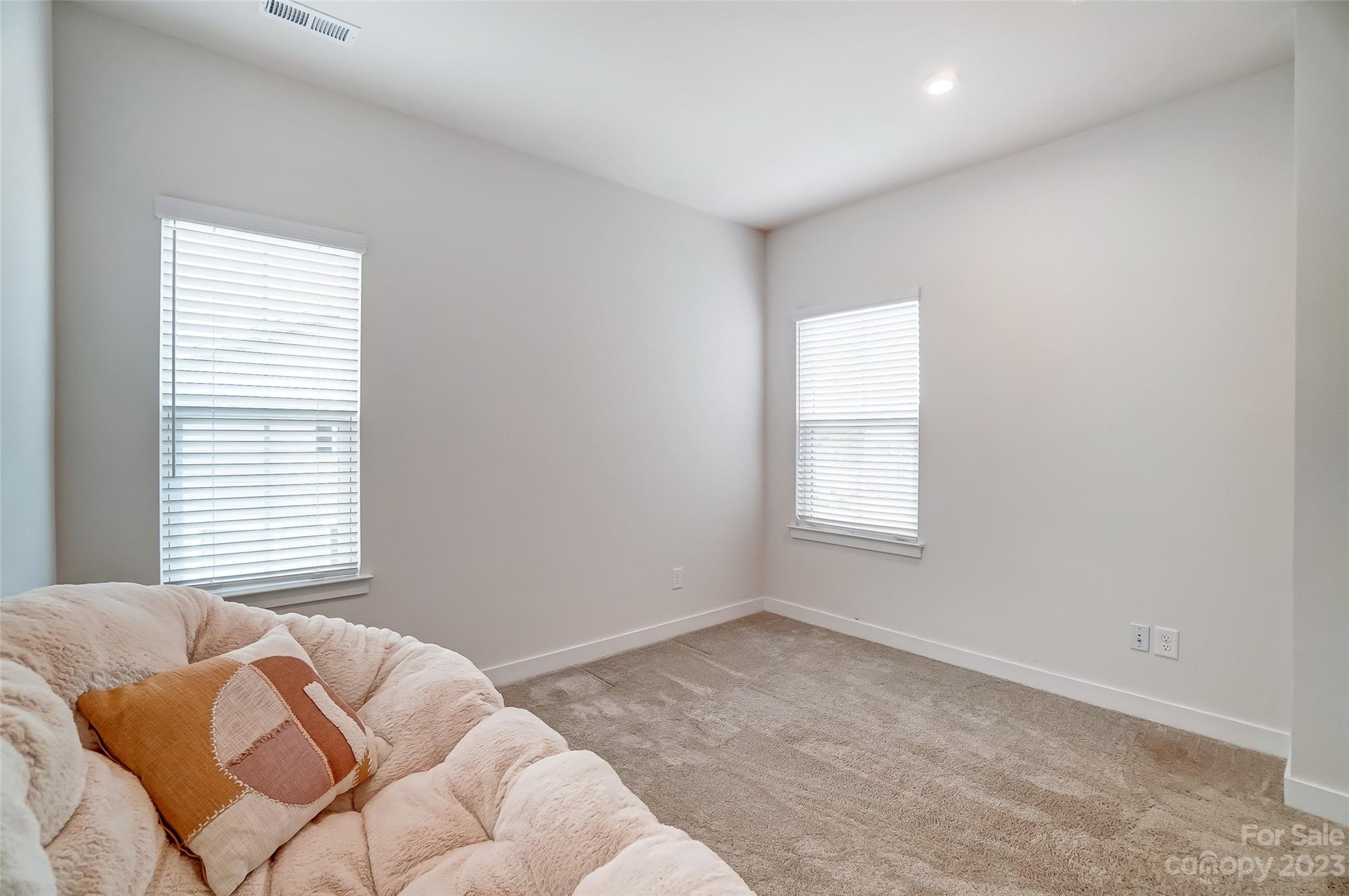 636 Crudent Road Tega Cay, SC 29708 - Photo 35 of 45 a bedroom with a bed and a window