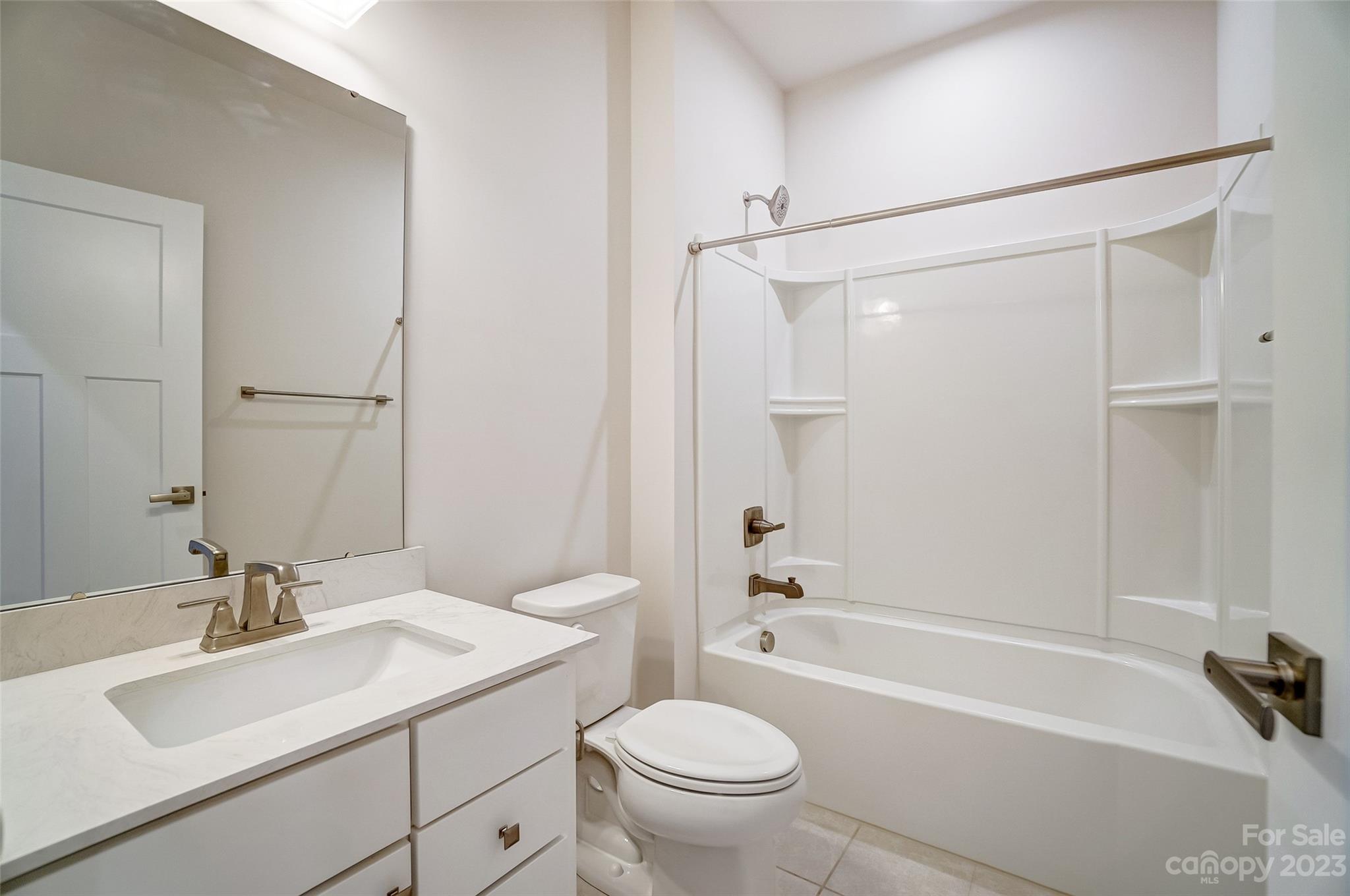636 Crudent Road Tega Cay, SC 29708 - Photo 37 of 45 a bathroom with a sink toilet and shower