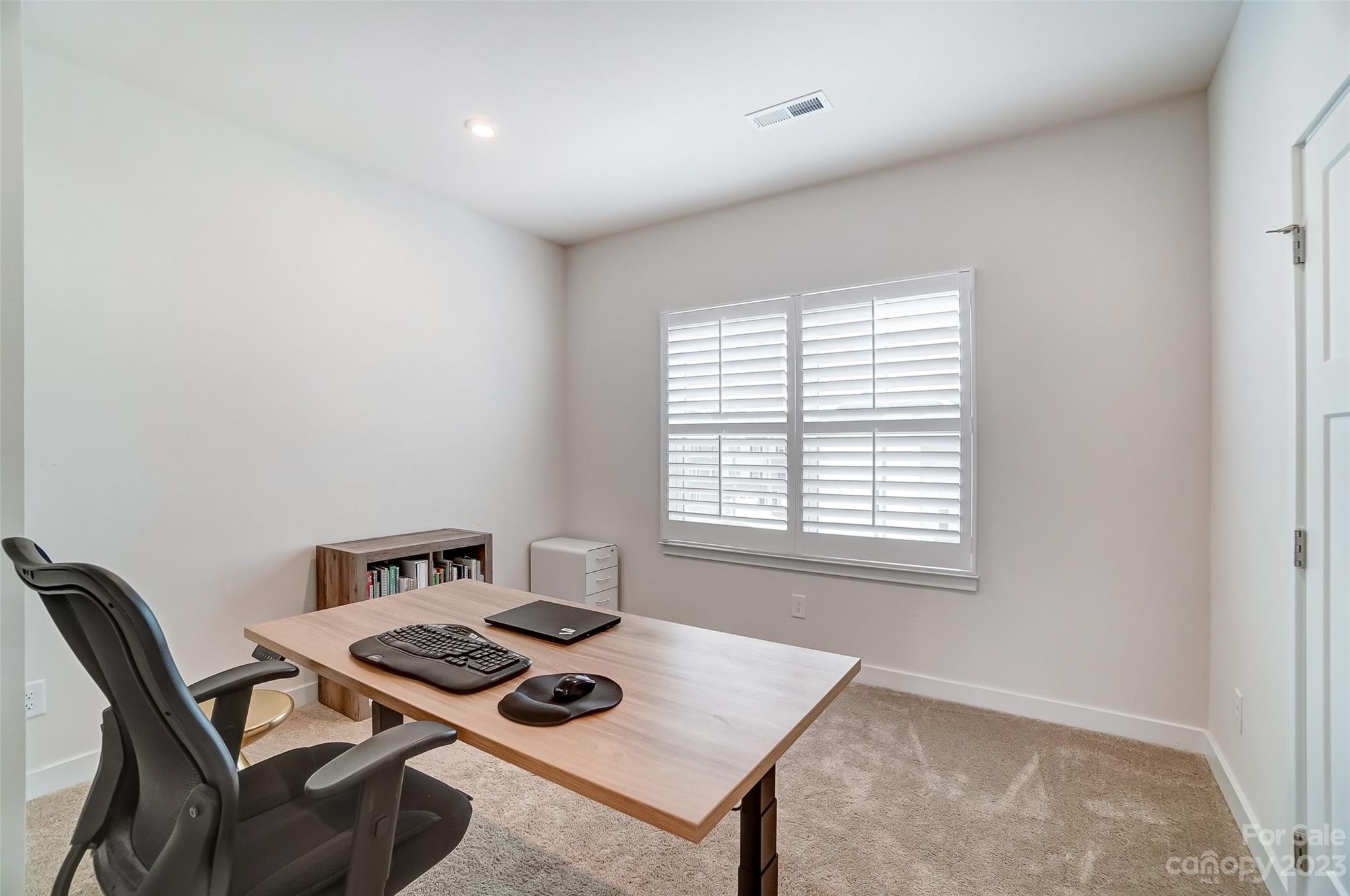 636 Crudent Road Tega Cay, SC 29708 - Photo 38 of 45 a view of a workspace with furniture and a window