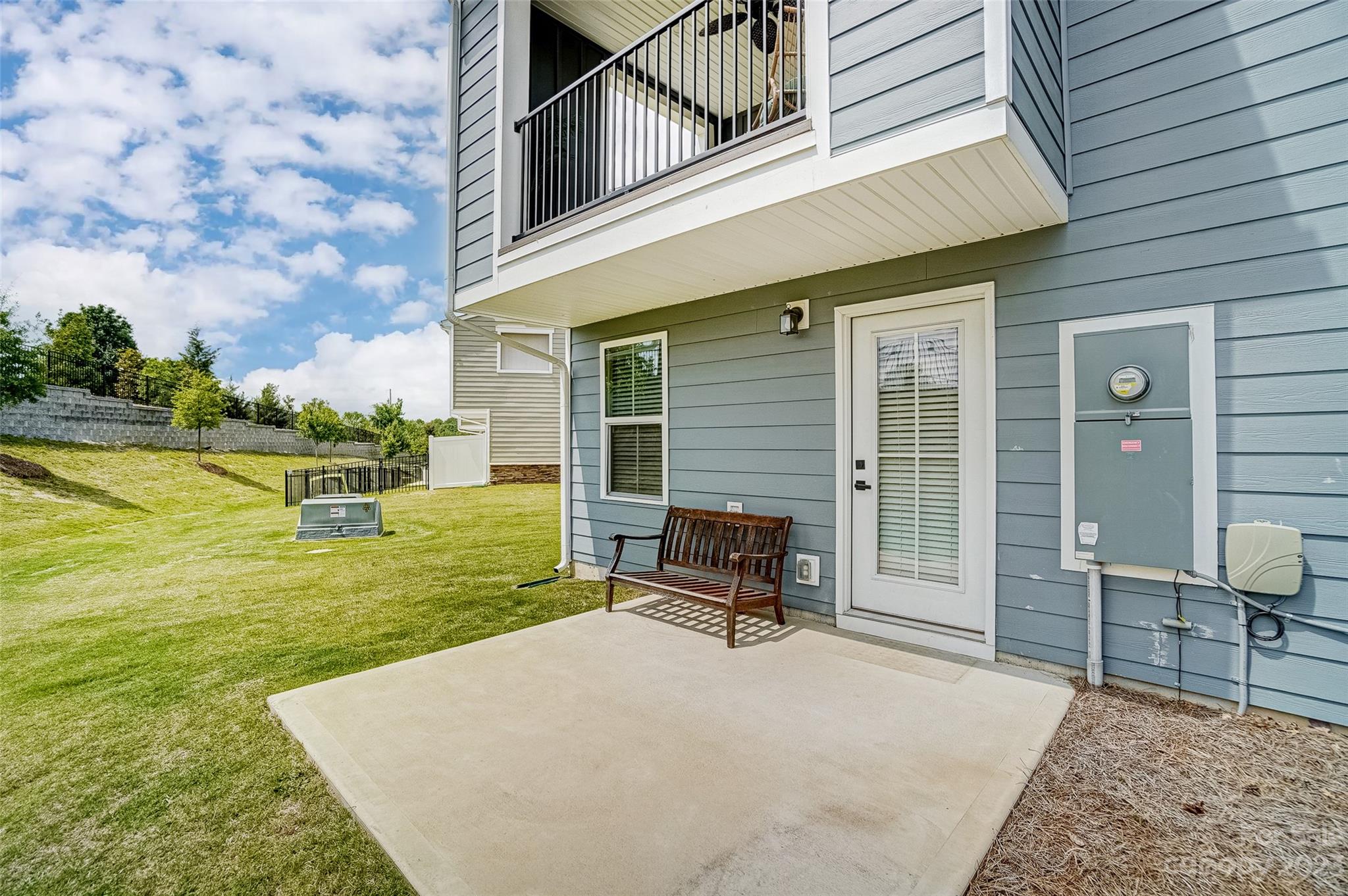 636 Crudent Road Tega Cay, SC 29708 - Photo 44 of 45 a view of a backyard with table and chairs and a barbeque