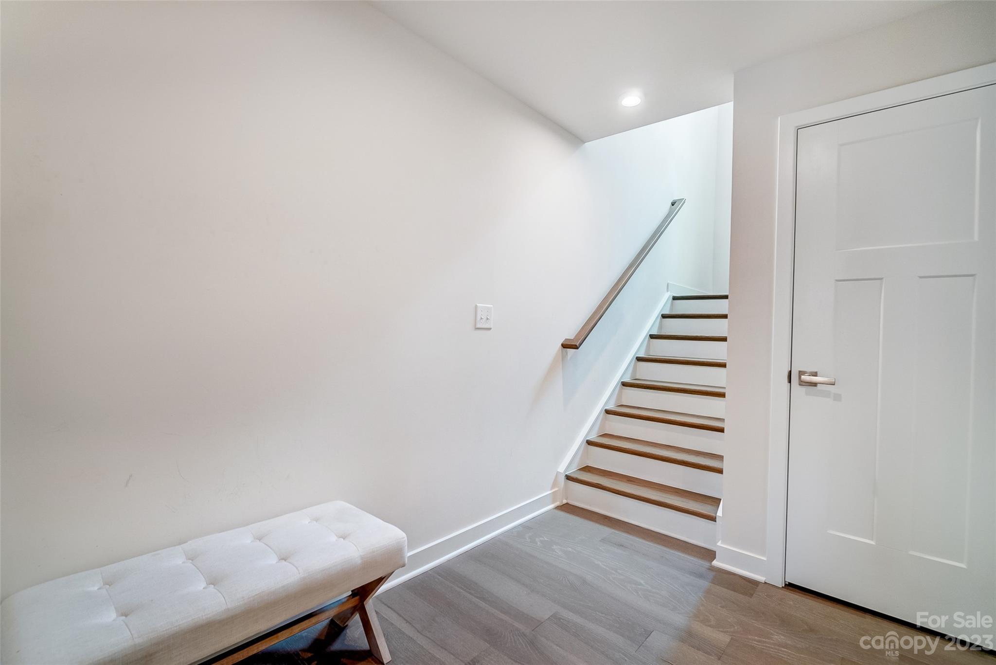 636 Crudent Road Tega Cay, SC 29708 - Photo 5 of 45 a view of a room with wooden floor and stairs