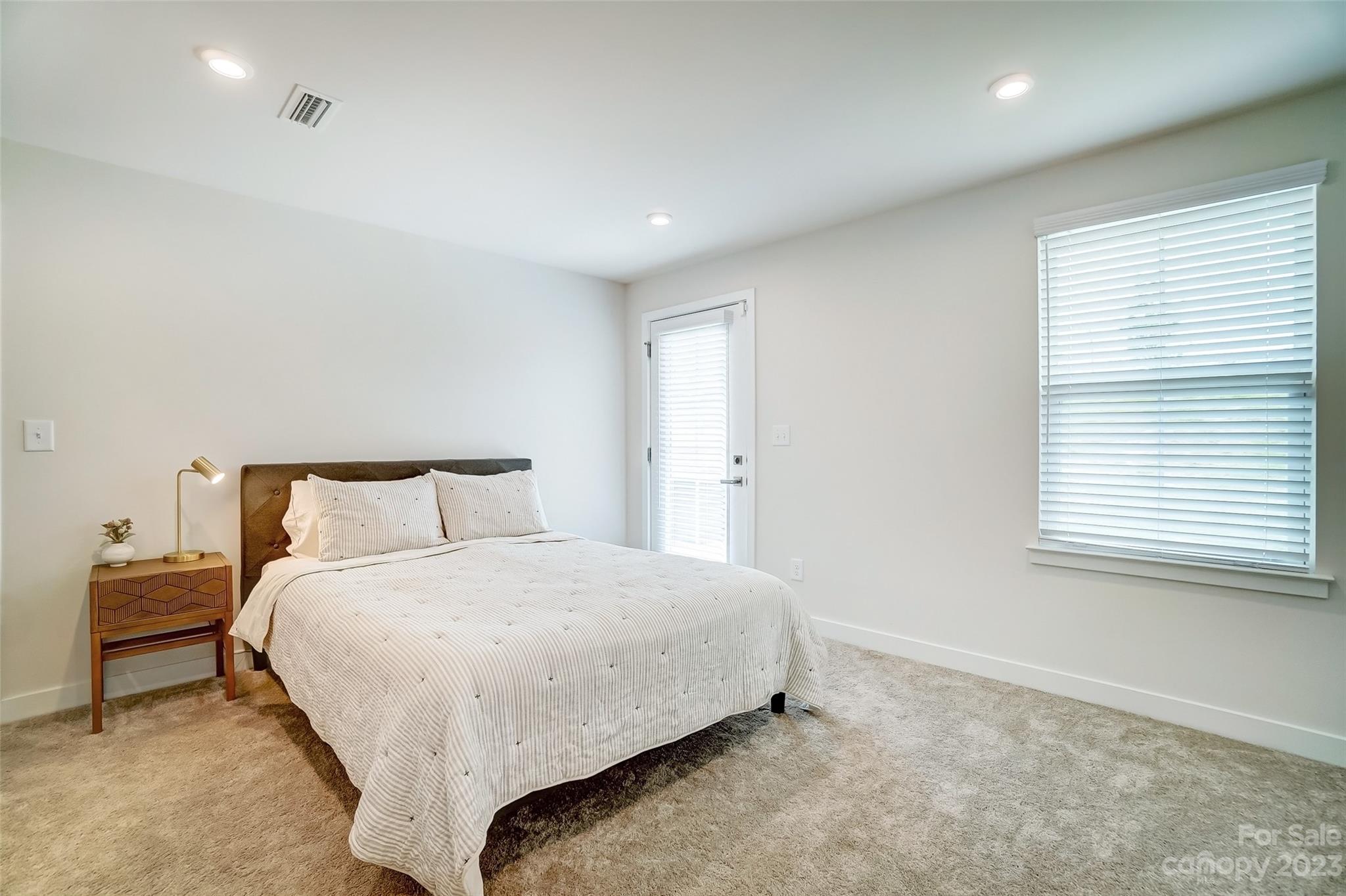 636 Crudent Road Tega Cay, SC 29708 - Photo 7 of 45 a large bed sitting in a bedroom next to a window