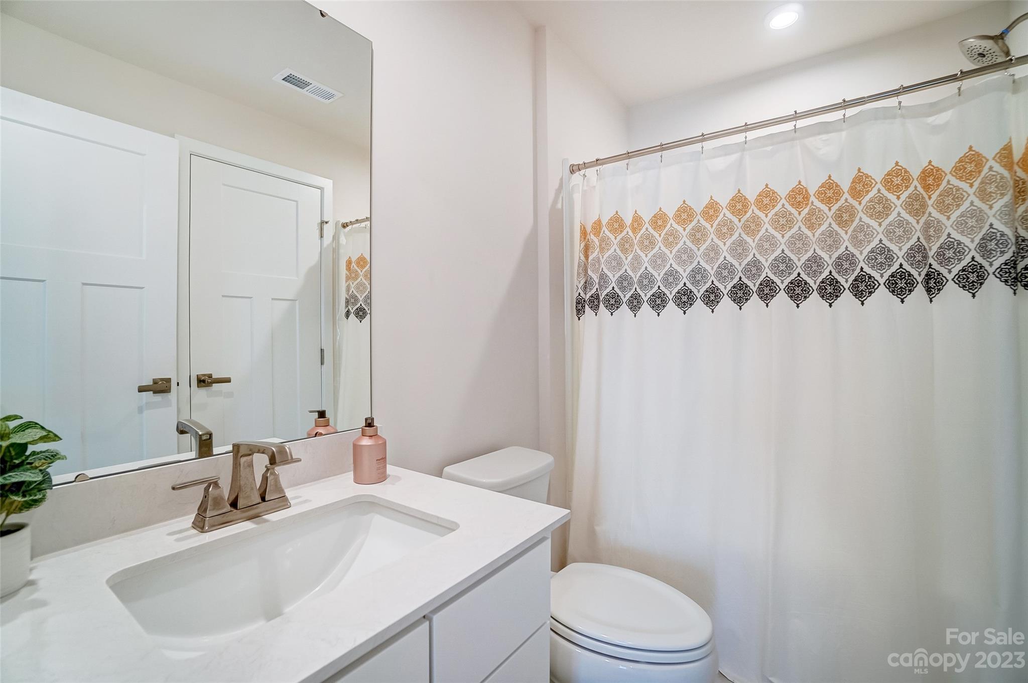 636 Crudent Road Tega Cay, SC 29708 - Photo 9 of 45 a bathroom with a sink toilet and shower