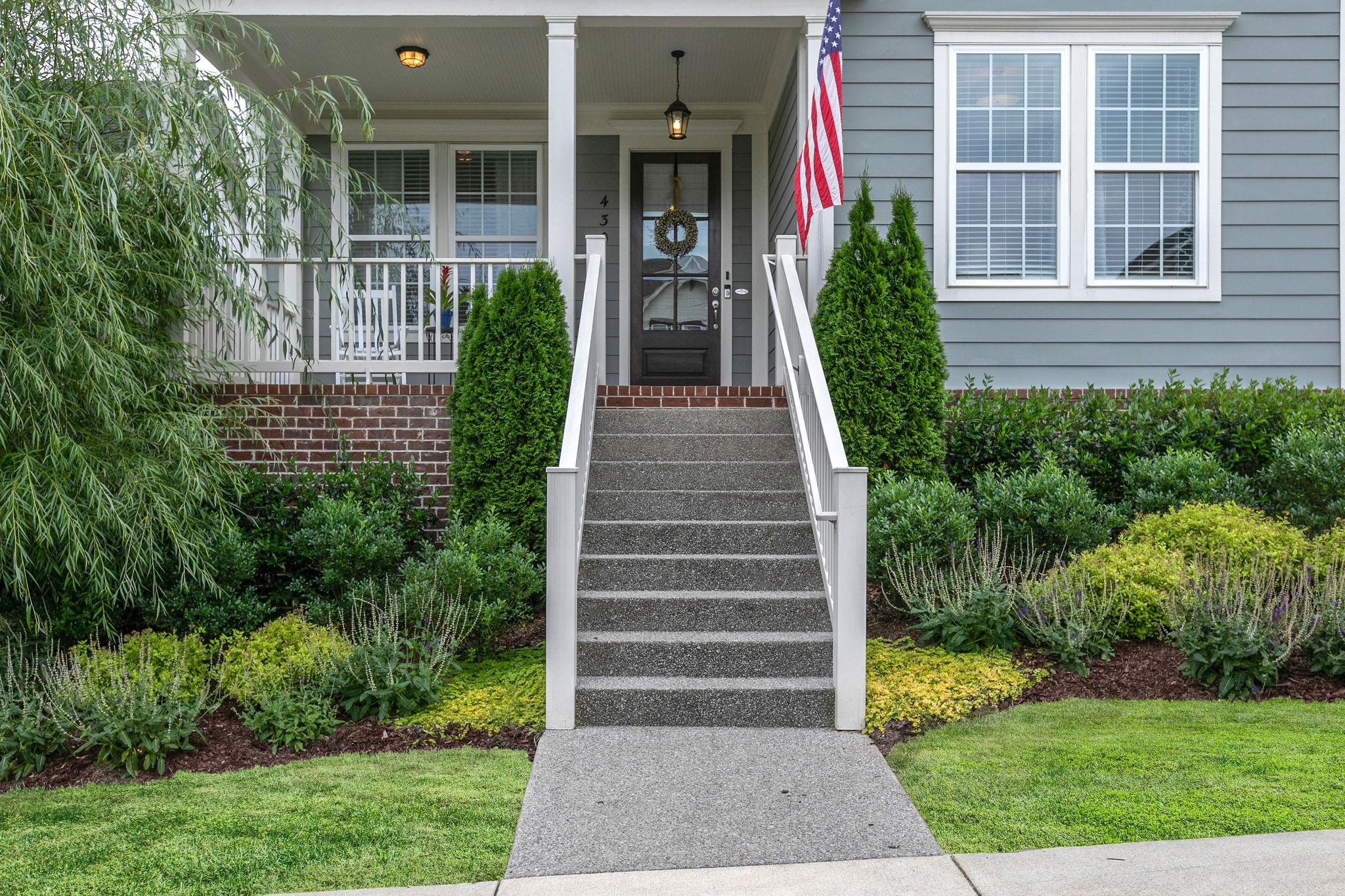 430 Alfred Ladd Road East Franklin, TN 37064 - Photo 2 of 30 Bring the rocking chairs for this large front covered porch.