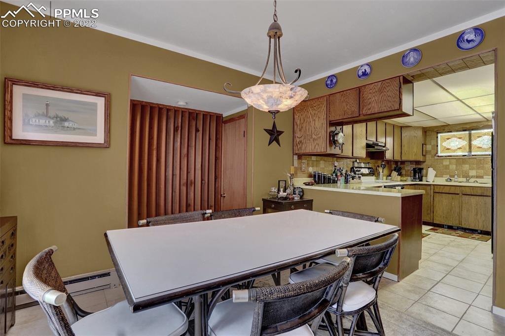 756 Spring Valley Drive Divide, CO 80814 - Photo 12 of 50 a view of a dining room with furniture