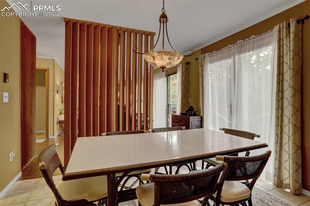 756 Spring Valley Drive Divide, CO 80814 - Photo 13 of 50 a dining room with a table and chairs
