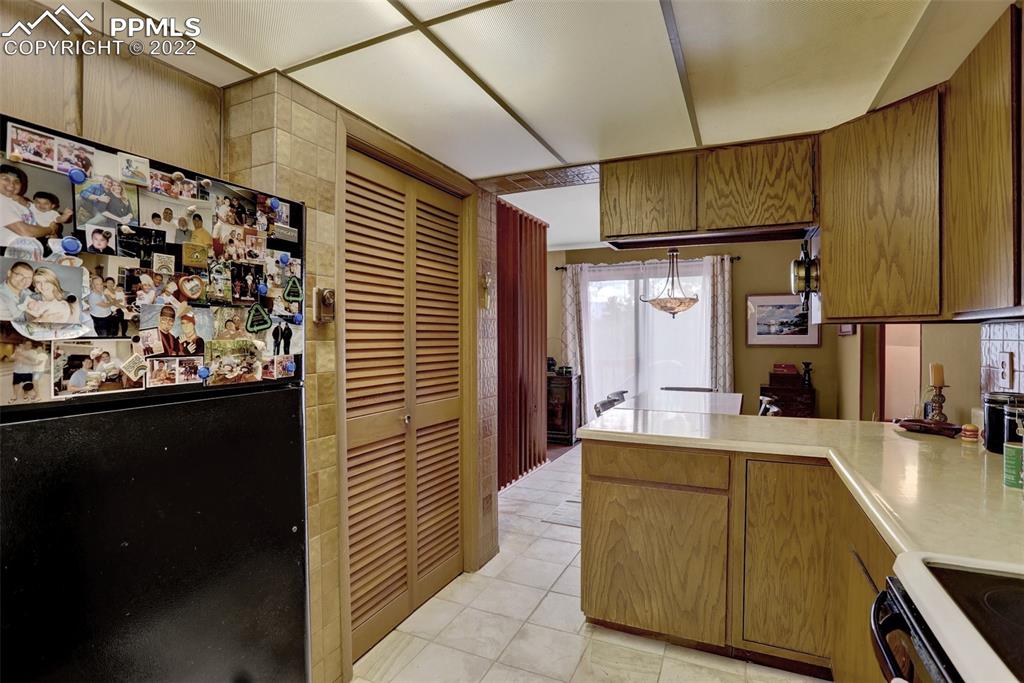 756 Spring Valley Drive Divide, CO 80814 - Photo 18 of 50 a kitchen with stainless steel appliances a refrigerator and a stove