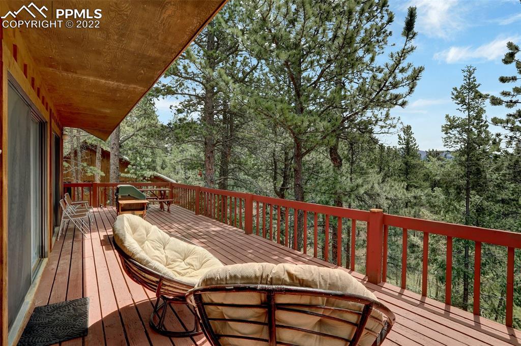 756 Spring Valley Drive Divide, CO 80814 - Photo 19 of 50 a view of a chairs and table in the balcony