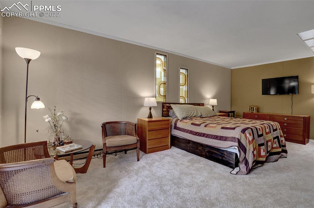 756 Spring Valley Drive Divide, CO 80814 - Photo 22 of 50 a bedroom with a bed and a couch