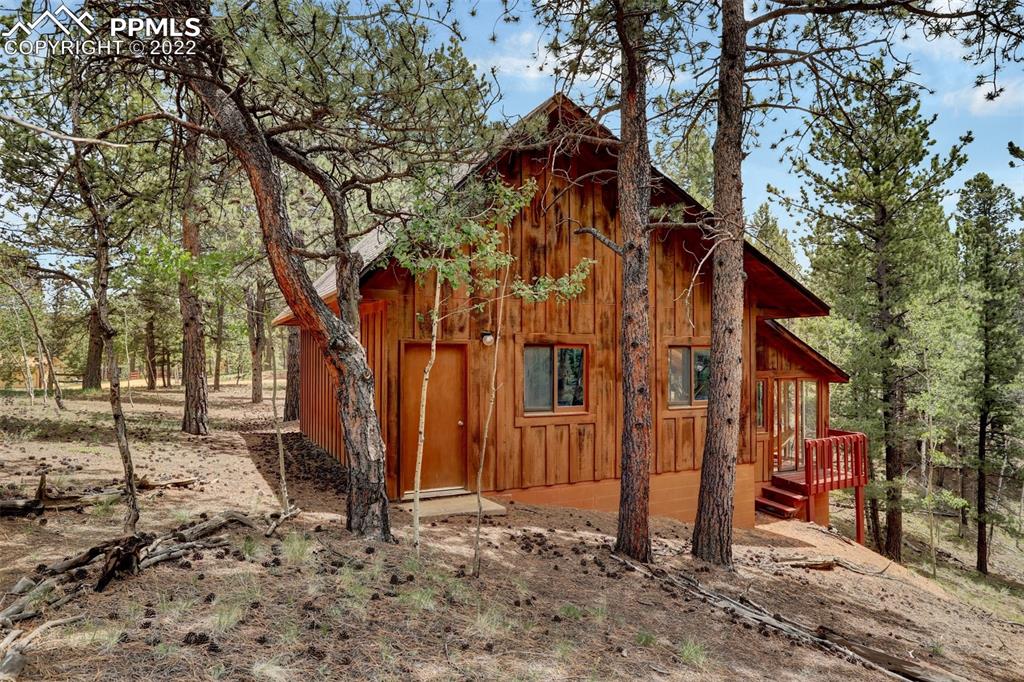 756 Spring Valley Drive Divide, CO 80814 - Photo 41 of 50 a view of a house with a yard