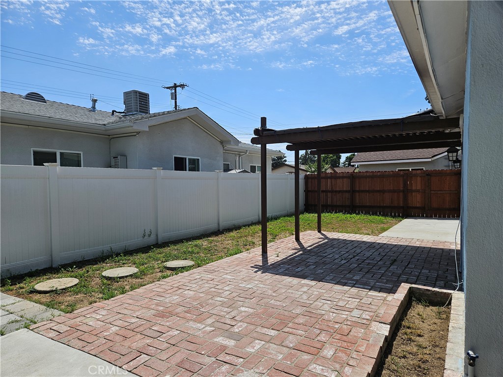 7820 Lindley Avenue Reseda, CA 91335 - Photo 15 of 16 a house with a bench in front of it