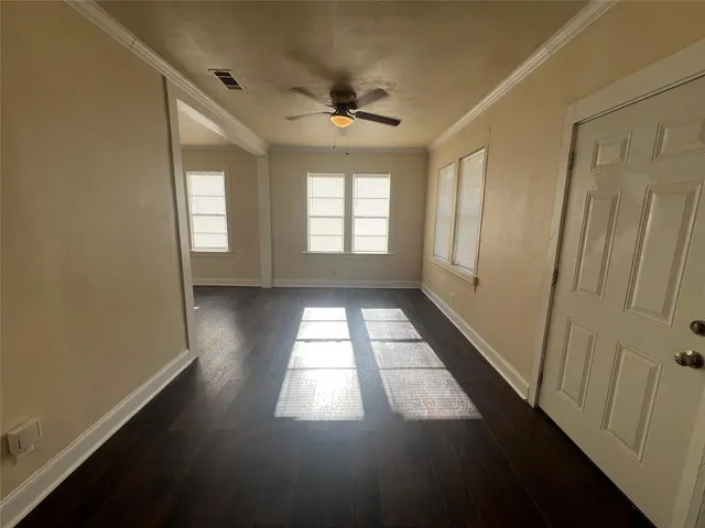 a view of empty room with windows