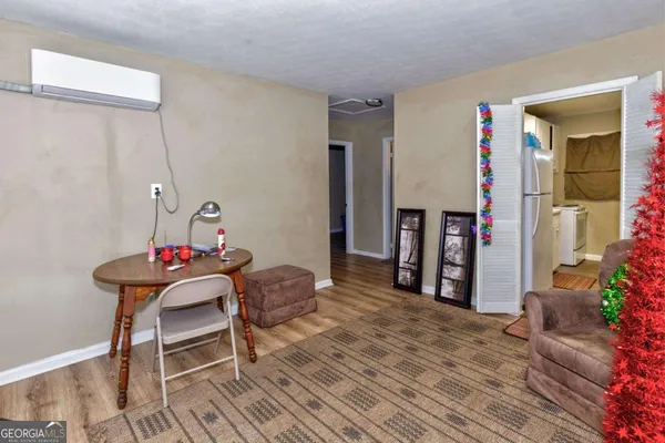 a room that has a table and a chair in it