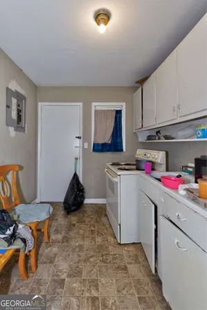 a room with a white cabinets and window